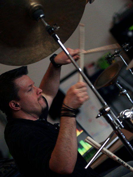 Ryan Rothmeyer playing drums at school